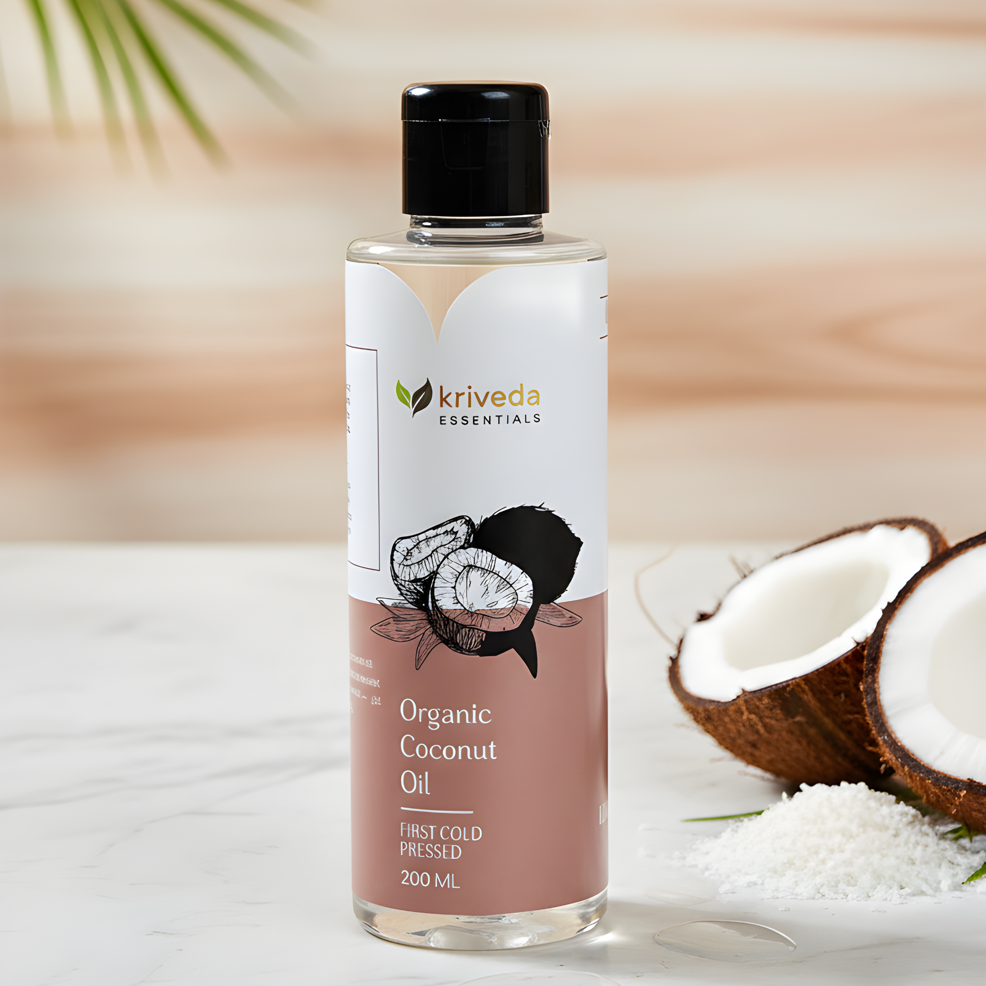 Kriveda Organic Coconut Oil bottle with a coconut half and coconut flakes on a light background